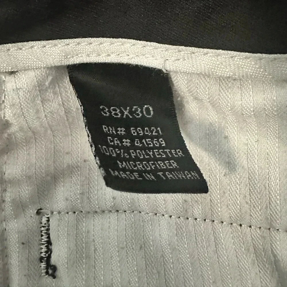 Greg Norman black, pleated golf slacks with a cuff.  Size 38x30